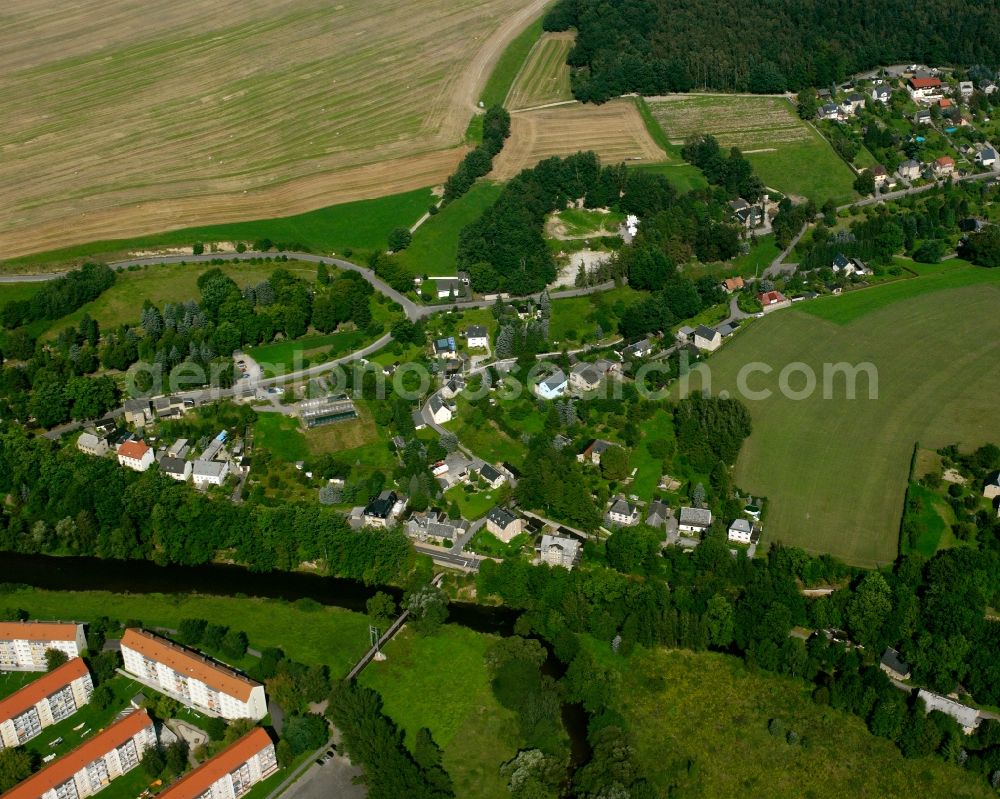 Flöha from the bird's eye view: Agricultural land and field boundaries surround the settlement area of the village in Flöha in the state Saxony, Germany