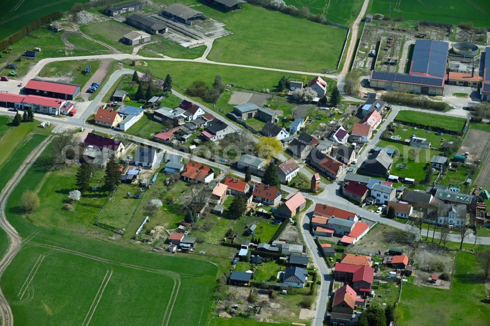 Aerial image Freudenberg - Agricultural land and field boundaries surround the settlement area of the village in Freudenberg in the state Brandenburg, Germany