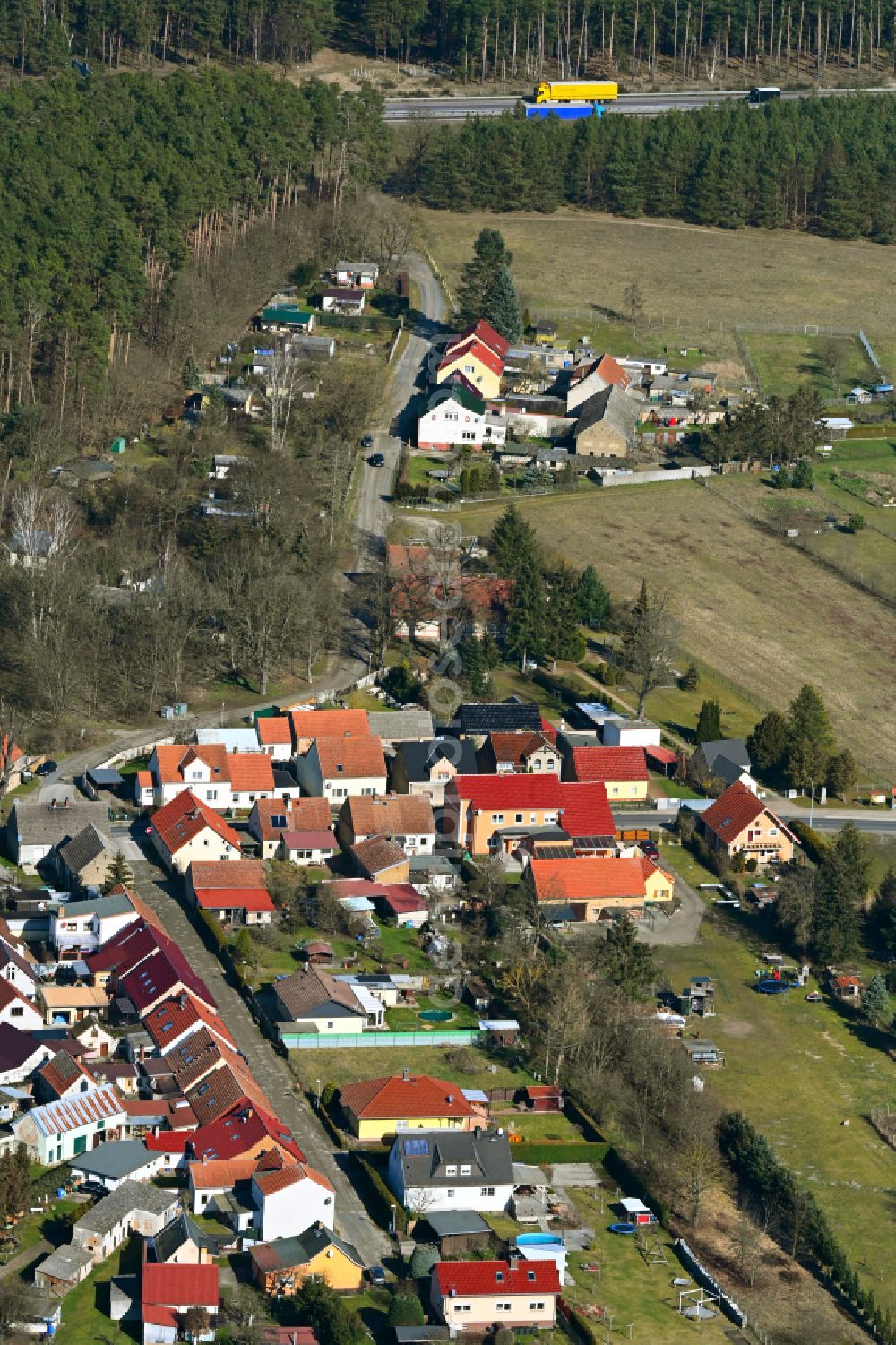 Aerial image Friedrichshof - Agricultural land and field boundaries surround the settlement area of the village in Friedrichshof in the state Brandenburg, Germany