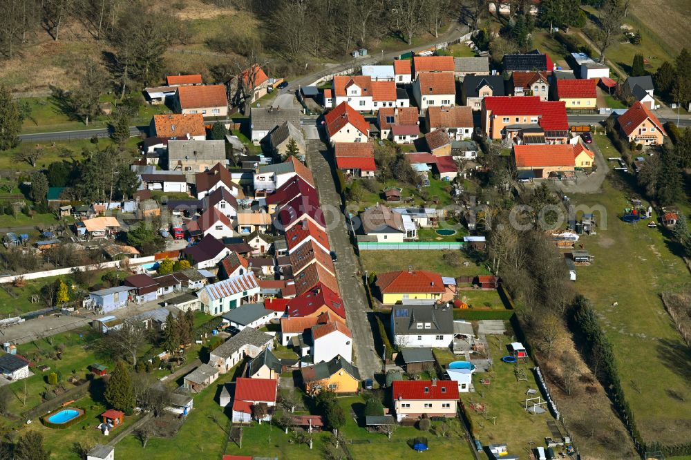 Friedrichshof from above - Agricultural land and field boundaries surround the settlement area of the village in Friedrichshof in the state Brandenburg, Germany