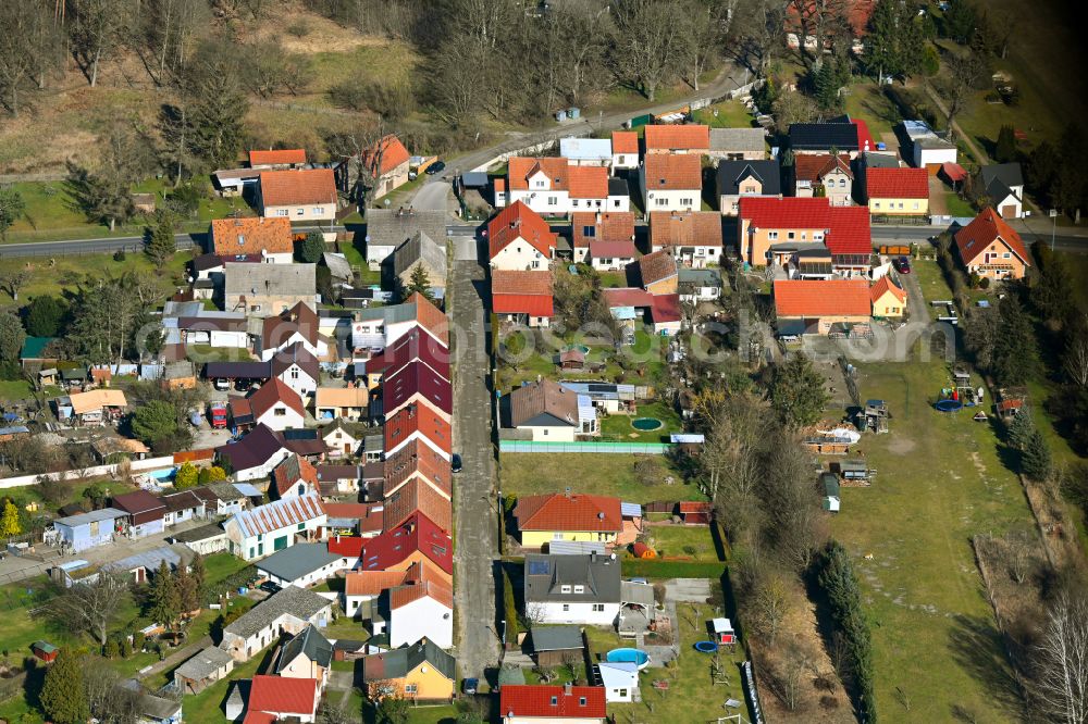 Friedrichshof from the bird's eye view: Agricultural land and field boundaries surround the settlement area of the village in Friedrichshof in the state Brandenburg, Germany