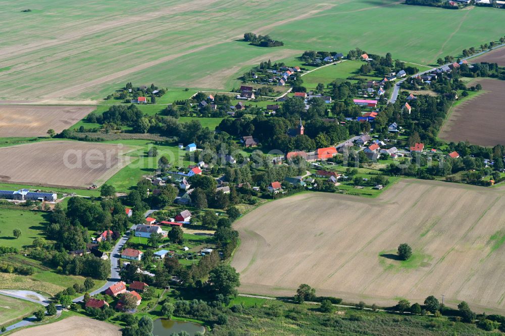 Ganschendorf from above - Agricultural land and field boundaries surround the settlement area of the village in Ganschendorf in the state Mecklenburg - Western Pomerania, Germany
