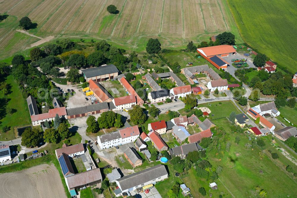 Aerial photograph Garrey - Agricultural land and field boundaries surround the settlement area of the village in Garrey in the state Brandenburg, Germany