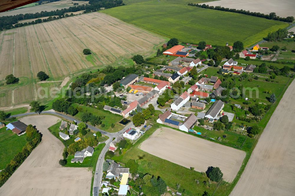 Garrey from above - Agricultural land and field boundaries surround the settlement area of the village in Garrey in the state Brandenburg, Germany