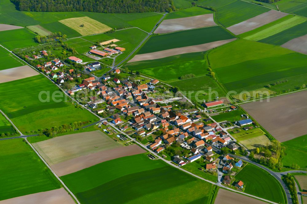 Aerial photograph Greuth - Agricultural land and field boundaries surround the settlement area of the village in Greuth in the state Bavaria, Germany