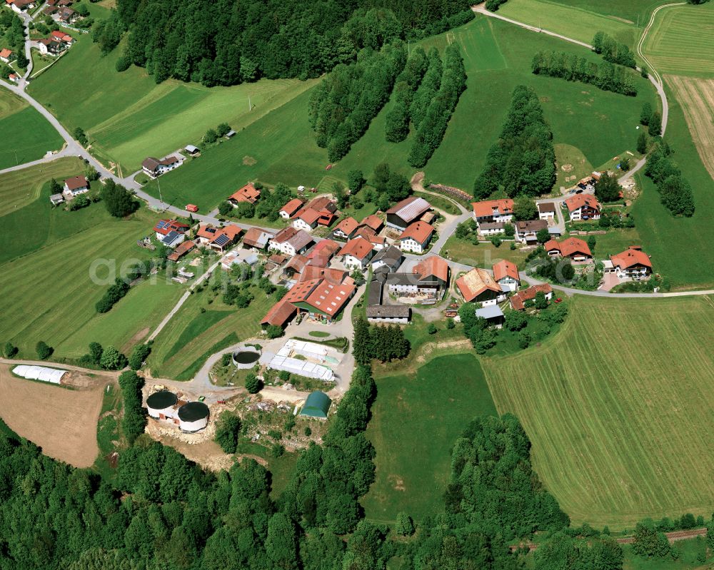Grillaberg from above - Agricultural land and field boundaries surround the settlement area of the village in Grillaberg in the state Bavaria, Germany
