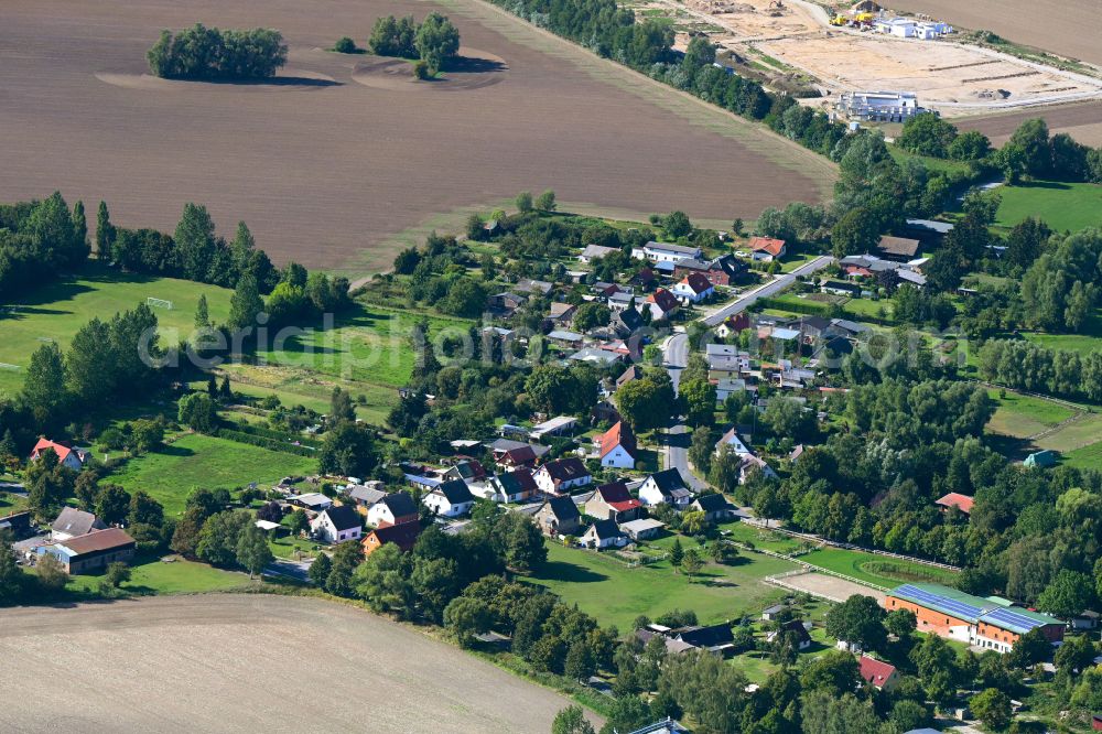 Groß Kordshagen from above - Agricultural land and field boundaries surround the settlement area of the village in Gross Kordshagen in the state Mecklenburg - Western Pomerania, Germany
