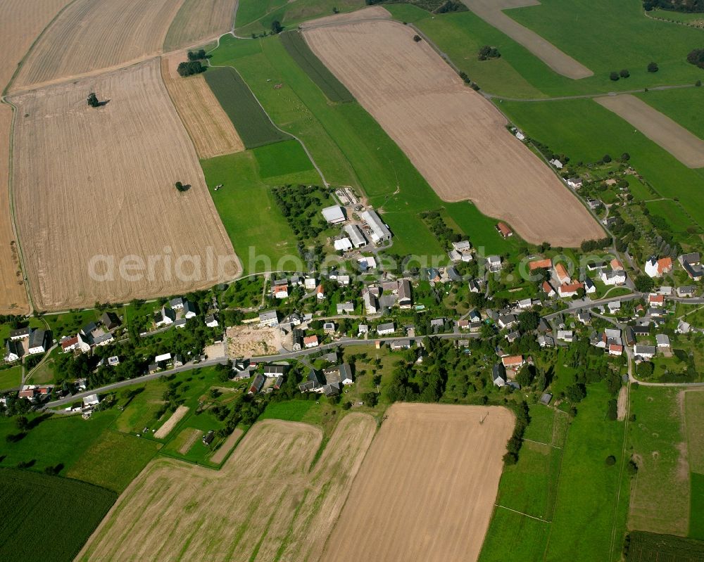Aerial image Großschirma - Agricultural land and field boundaries surround the settlement area of the village in Großschirma in the state Saxony, Germany