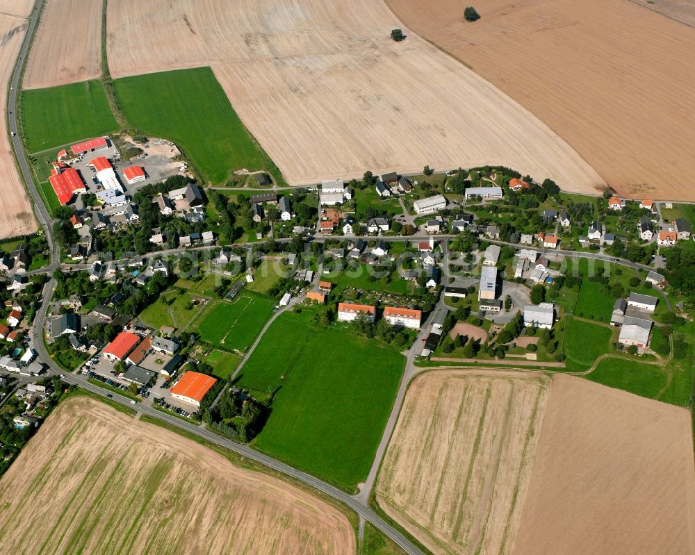 Großschirma from above - Agricultural land and field boundaries surround the settlement area of the village in Großschirma in the state Saxony, Germany