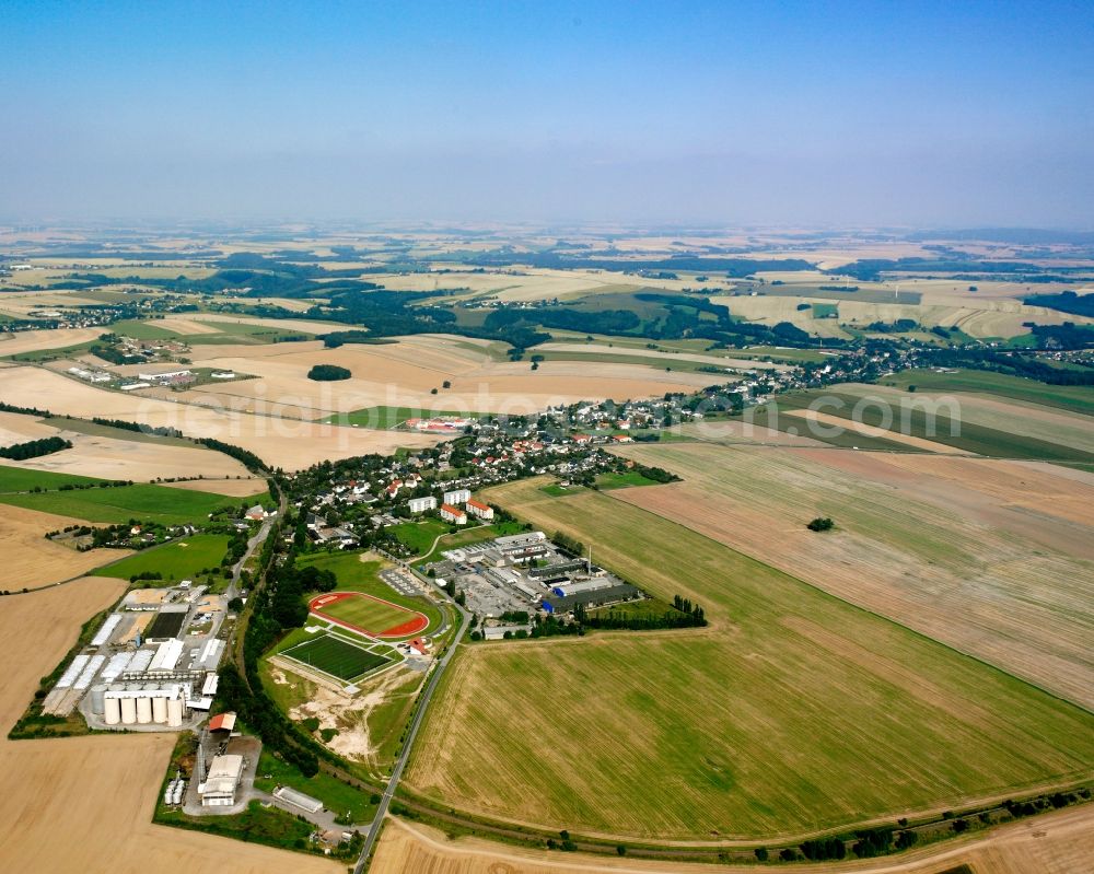 Aerial image Großschirma - Agricultural land and field boundaries surround the settlement area of the village in Großschirma in the state Saxony, Germany