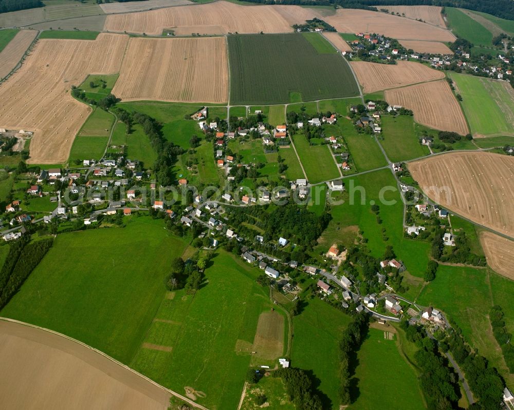 Großvoigtsberg from above - Agricultural land and field boundaries surround the settlement area of the village in Großvoigtsberg in the state Saxony, Germany