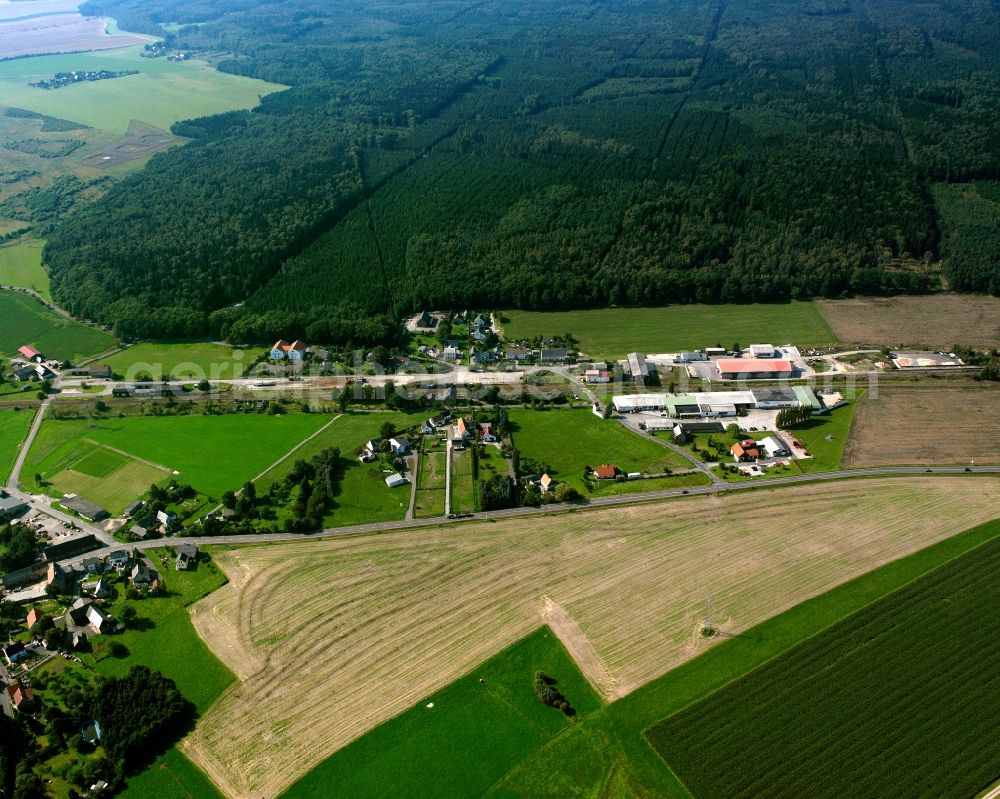 Aerial image Großvoigtsberg - Agricultural land and field boundaries surround the settlement area of the village in Großvoigtsberg in the state Saxony, Germany