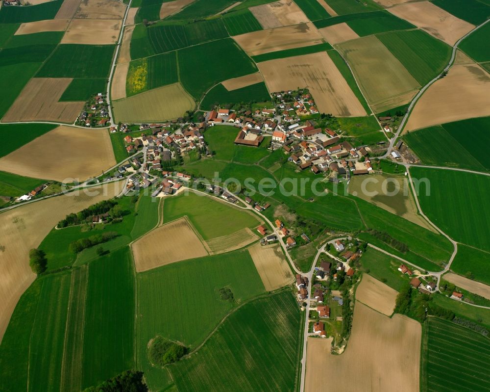 Hailing from the bird's eye view: Agricultural land and field boundaries surround the settlement area of the village in Hailing in the state Bavaria, Germany