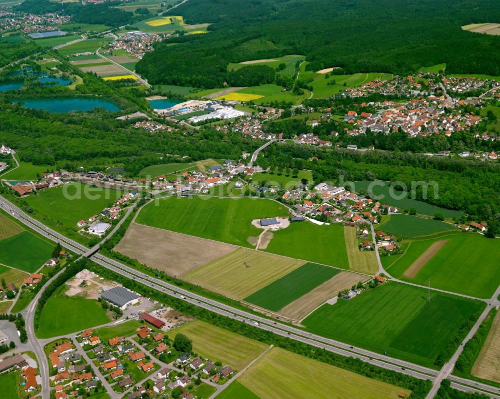 Hammerschmiede from above - Agricultural land and field boundaries surround the settlement area of the village in Hammerschmiede in the state Baden-Wuerttemberg, Germany