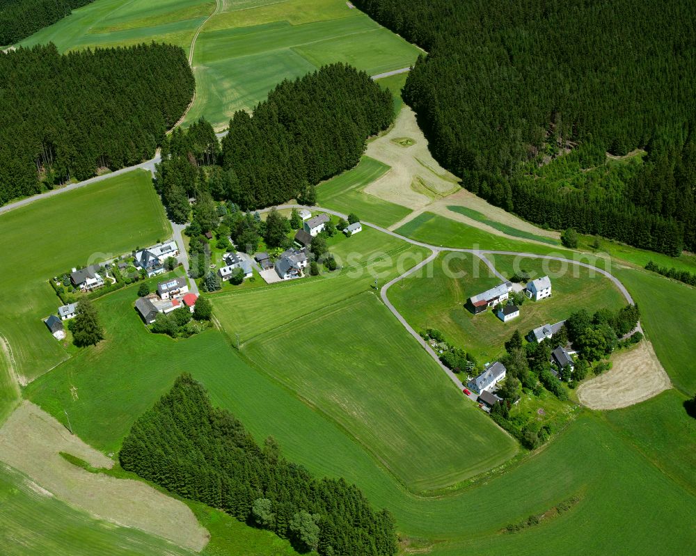 Haueisen from above - Agricultural land and field boundaries surround the settlement area of the village in Haueisen in the state Bavaria, Germany