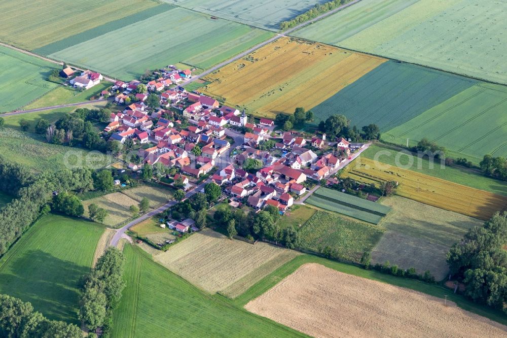 Aerial image Hausen - Agricultural land and field boundaries surround the settlement area of the village in Hausen in the state Thuringia, Germany