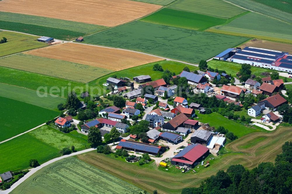 Hebersdorf from above - Agricultural land and field boundaries surround the settlement area of the village in Hebersdorf in the state Bavaria, Germany