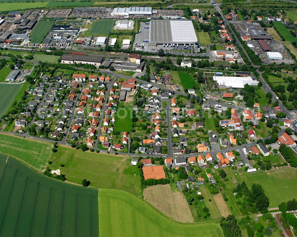 Hedemünden from the bird's eye view: Agricultural land and field boundaries surround the settlement area of the village in Hedemünden in the state Lower Saxony, Germany