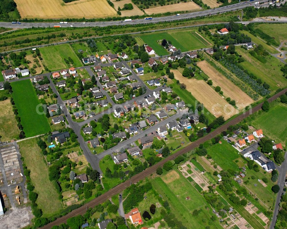 Aerial photograph Hedemünden - Agricultural land and field boundaries surround the settlement area of the village in Hedemünden in the state Lower Saxony, Germany