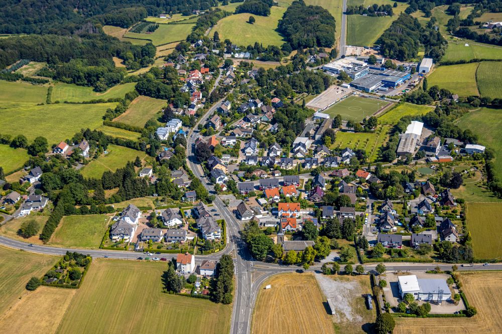 Aerial image Herzkamp - Agricultural land and field boundaries surround the settlement area of the village in Herzkamp in the state North Rhine-Westphalia, Germany