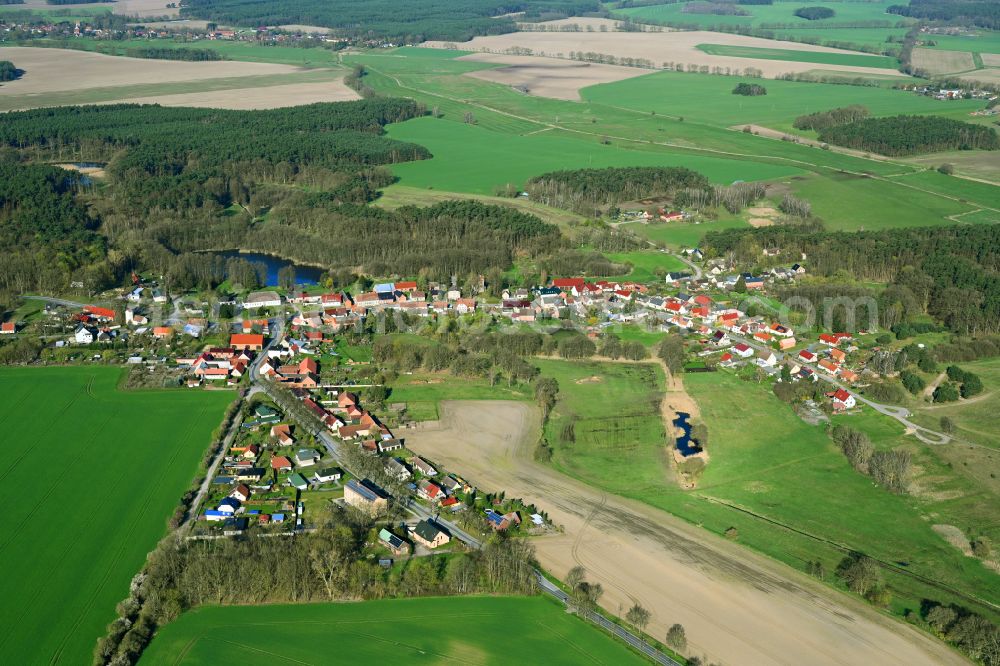 Herzsprung from above - Agricultural land and field boundaries surround the settlement area of the village on street Dorfstrasse in Herzsprung in the state Brandenburg, Germany