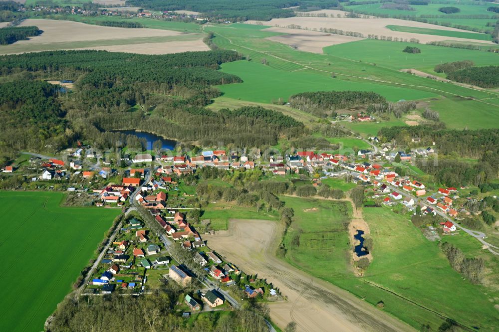 Herzsprung from the bird's eye view: Agricultural land and field boundaries surround the settlement area of the village on street Dorfstrasse in Herzsprung in the state Brandenburg, Germany