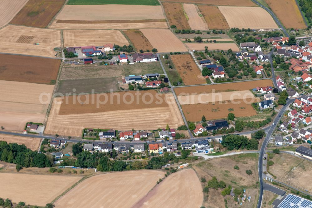 Aerial image Heßdorf - Agricultural land and field boundaries surround the settlement area of the village in Heßdorf in the state Bavaria, Germany