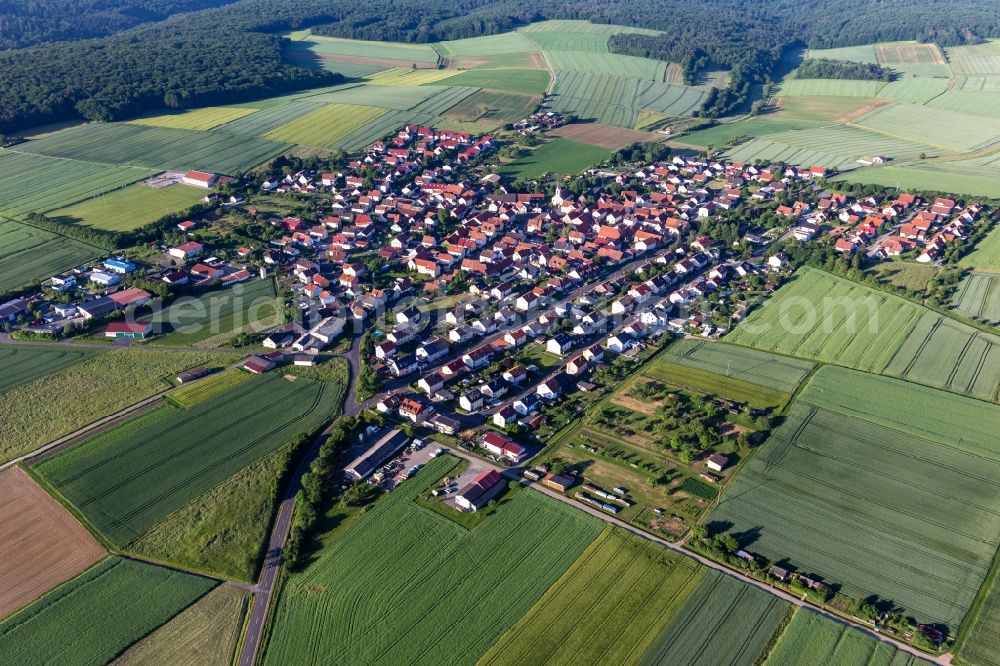 Hesselbach from above - Agricultural land and field boundaries surround the settlement area of the village in Hesselbach in the state Bavaria, Germany