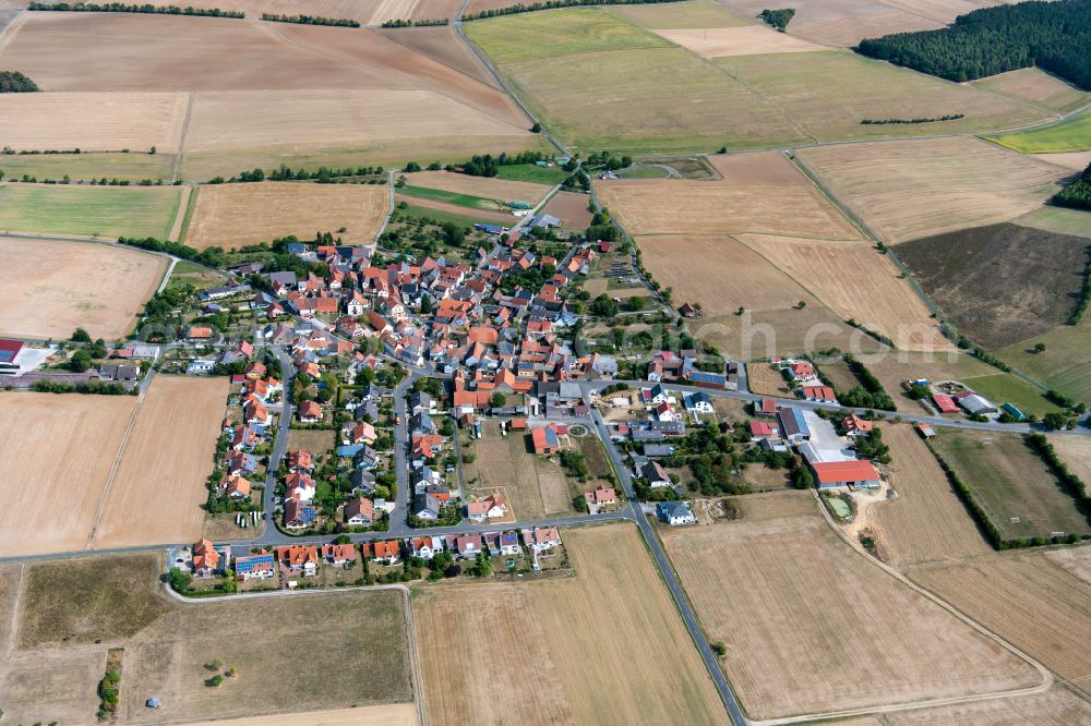 Aerial image Heßlar - Agricultural land and field boundaries surround the settlement area of the village in Heßlar in the state Bavaria, Germany