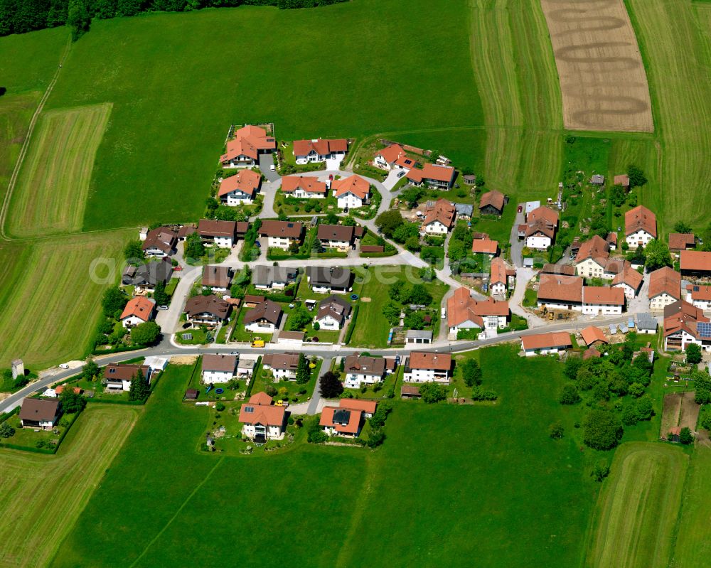 Hintereben from above - Agricultural land and field boundaries surround the settlement area of the village in Hintereben in the state Bavaria, Germany