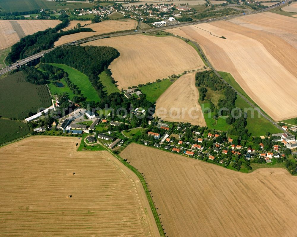 Aerial image Hirschfeld - Agricultural land and field boundaries surround the settlement area of the village in Hirschfeld in the state Saxony, Germany