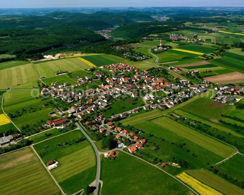 Hohenstadt from above - Agricultural land and field boundaries surround the settlement area of the village in Hohenstadt in the state Baden-Wuerttemberg, Germany