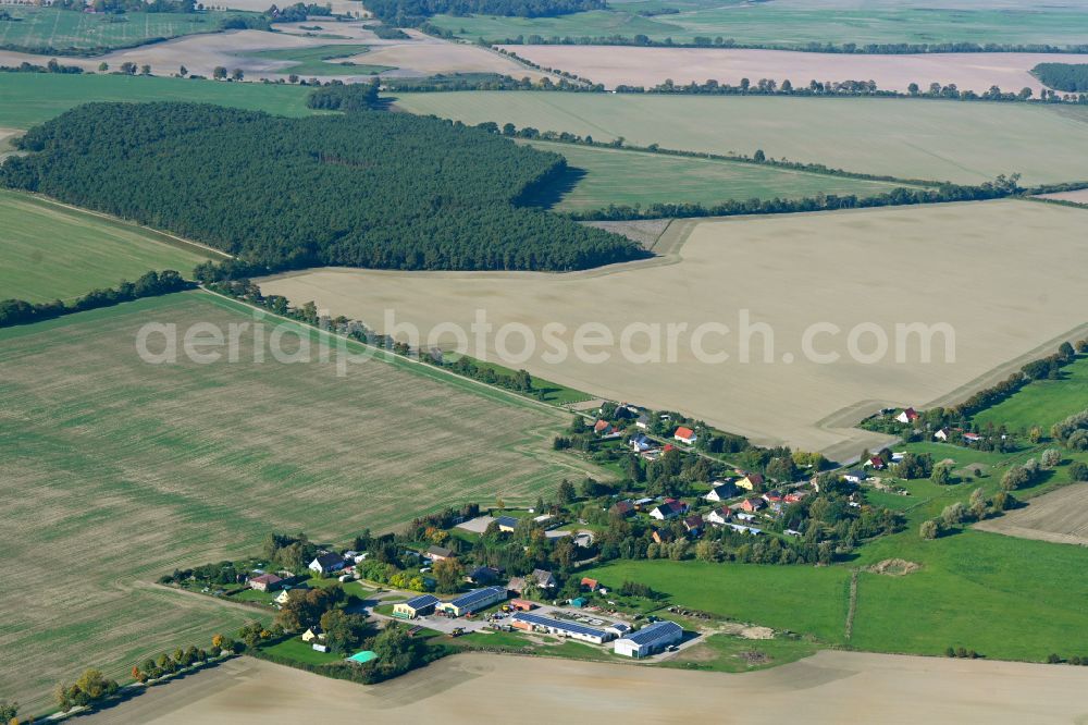 Hohenstein from above - Agricultural land and field boundaries surround the settlement area of the village in Hohenstein in the state Mecklenburg - Western Pomerania, Germany