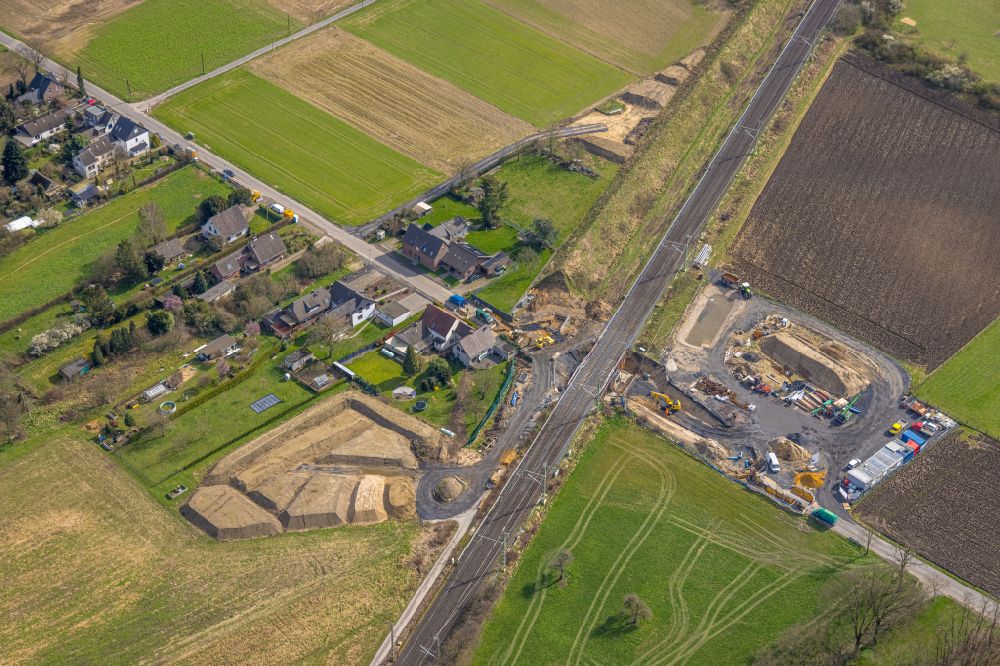 Holthausen from above - Agricultural land and field boundaries surround the settlement area of the village in Holthausen in the state North Rhine-Westphalia, Germany