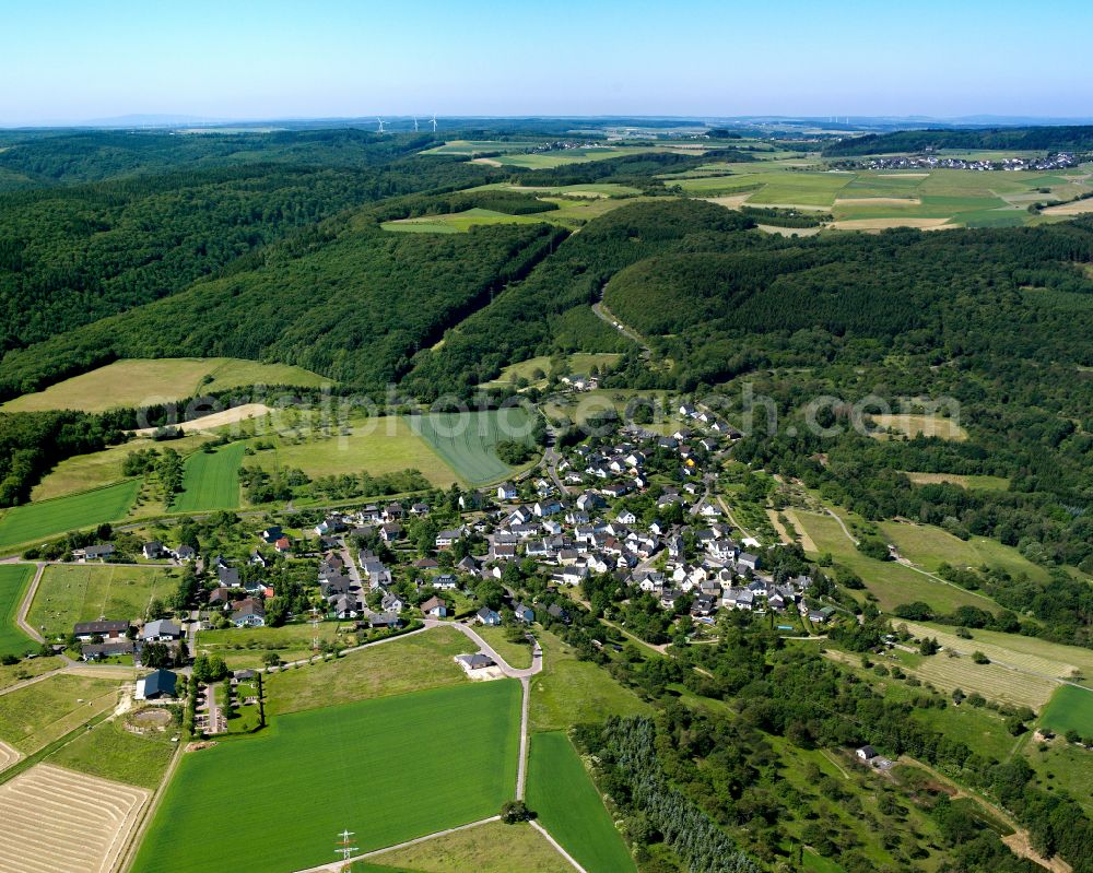 Holzfeld from above - Agricultural land and field boundaries surround the settlement area of the village in Holzfeld in the state Rhineland-Palatinate, Germany