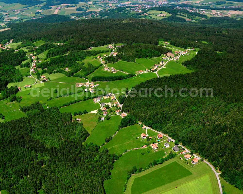 Aerial photograph Holzfreyung - Agricultural land and field boundaries surround the settlement area of the village in Holzfreyung in the state Bavaria, Germany