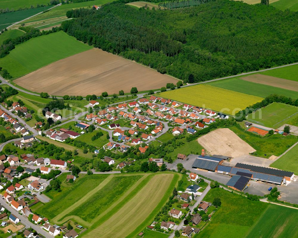 Hürbel from above - Agricultural land and field boundaries surround the settlement area of the village in Hürbel in the state Baden-Wuerttemberg, Germany