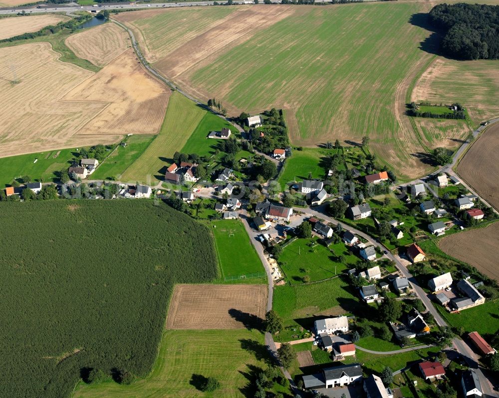 Aerial image Irbersdorf - Agricultural land and field boundaries surround the settlement area of the village in Irbersdorf in the state Saxony, Germany