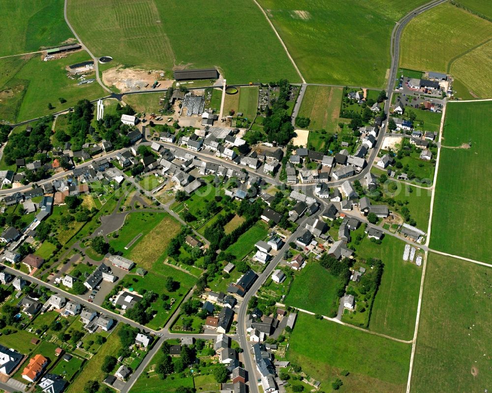 Katzenloch from above - Agricultural land and field boundaries surround the settlement area of the village in Katzenloch in the state Rhineland-Palatinate, Germany
