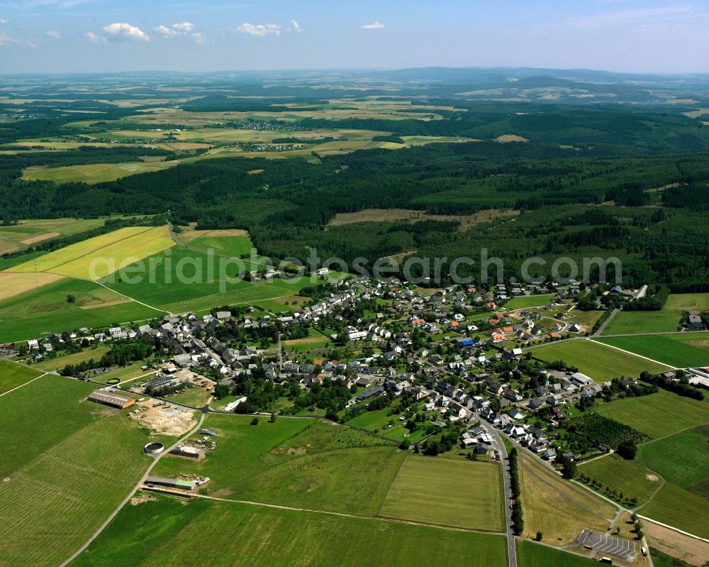 Aerial photograph Kempfeld - Agricultural land and field boundaries surround the settlement area of the village in Kempfeld in the state Rhineland-Palatinate, Germany