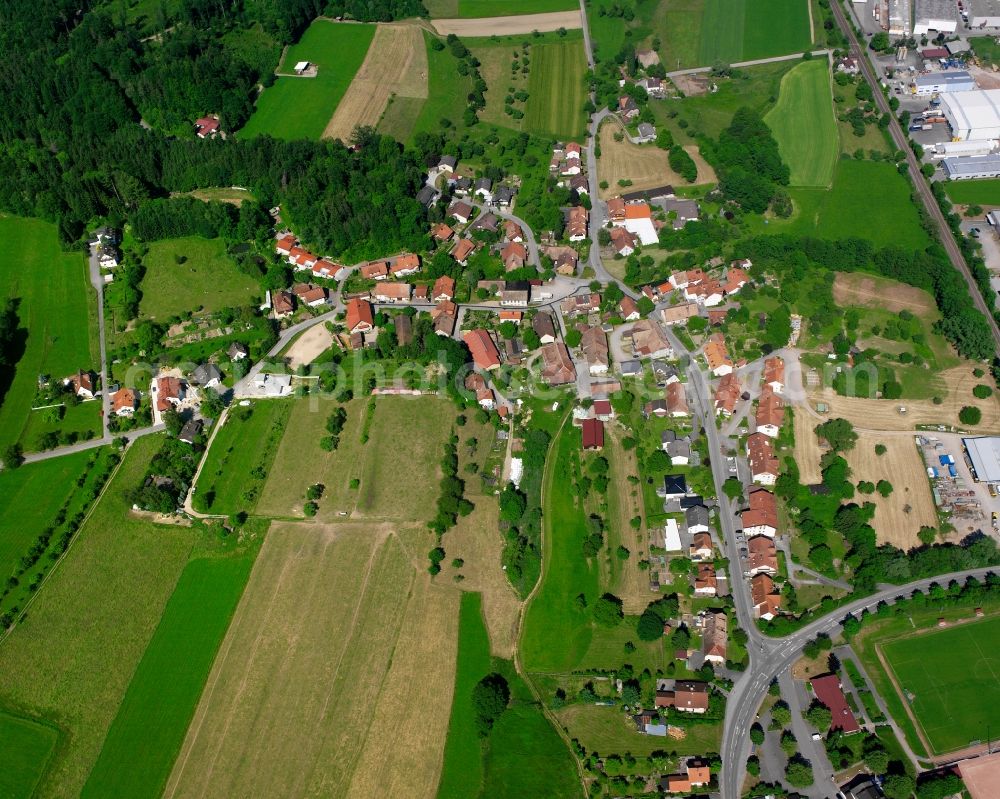 Kiesenbach from the bird's eye view: Agricultural land and field boundaries surround the settlement area of the village in Kiesenbach in the state Baden-Wuerttemberg, Germany