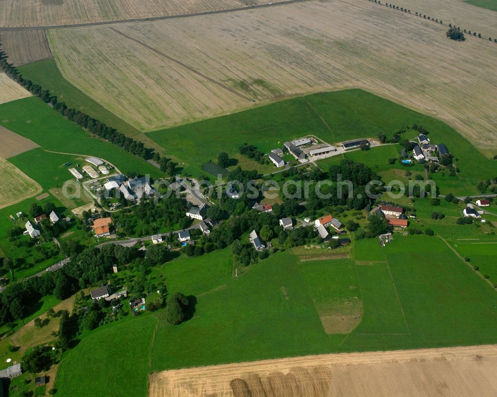Kirchbach from above - Agricultural land and field boundaries surround the settlement area of the village in Kirchbach in the state Saxony, Germany