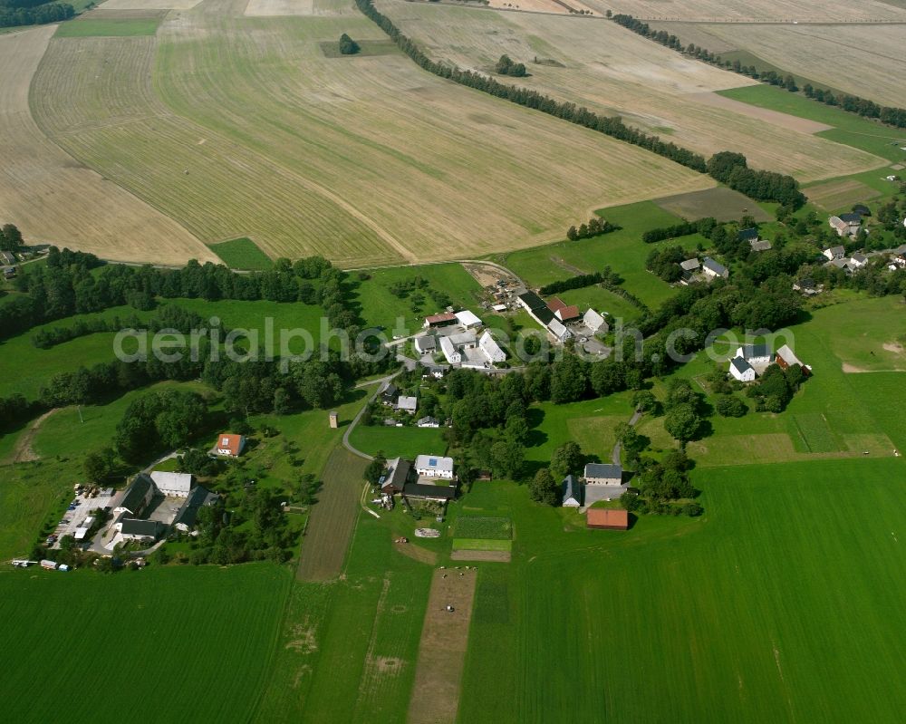 Kirchbach from the bird's eye view: Agricultural land and field boundaries surround the settlement area of the village in Kirchbach in the state Saxony, Germany