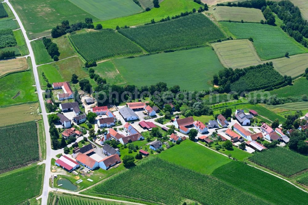 Kleinreichertshofen from the bird's eye view: Agricultural land and field boundaries surround the settlement area of the village in Kleinreichertshofen in the state Bavaria, Germany