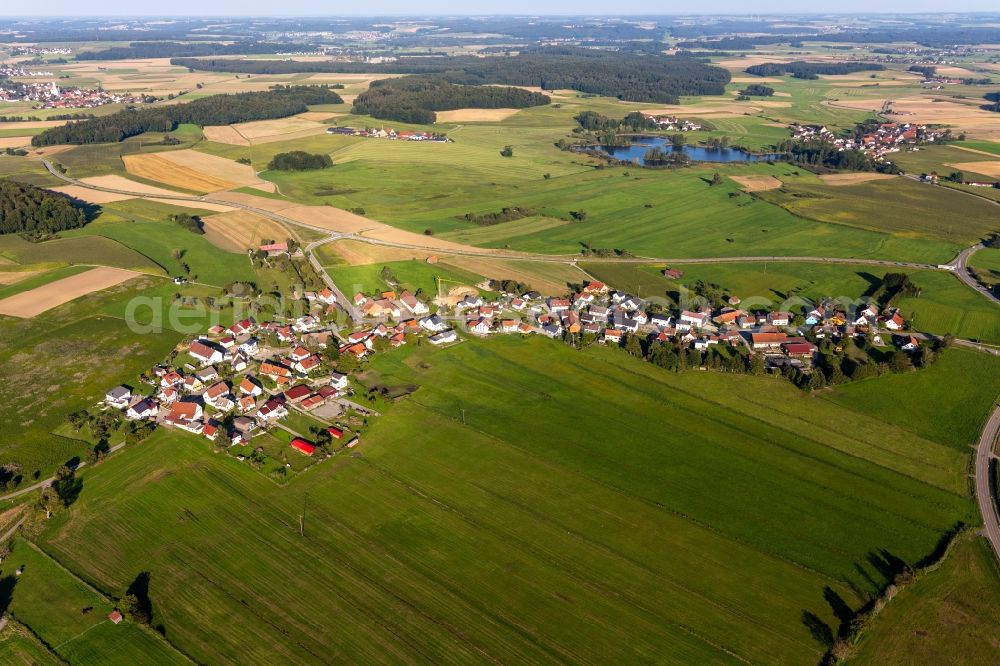 Kleinwinnaden from above - Agricultural land and field boundaries surround the settlement area of the village in Kleinwinnaden in the state Baden-Wuerttemberg, Germany