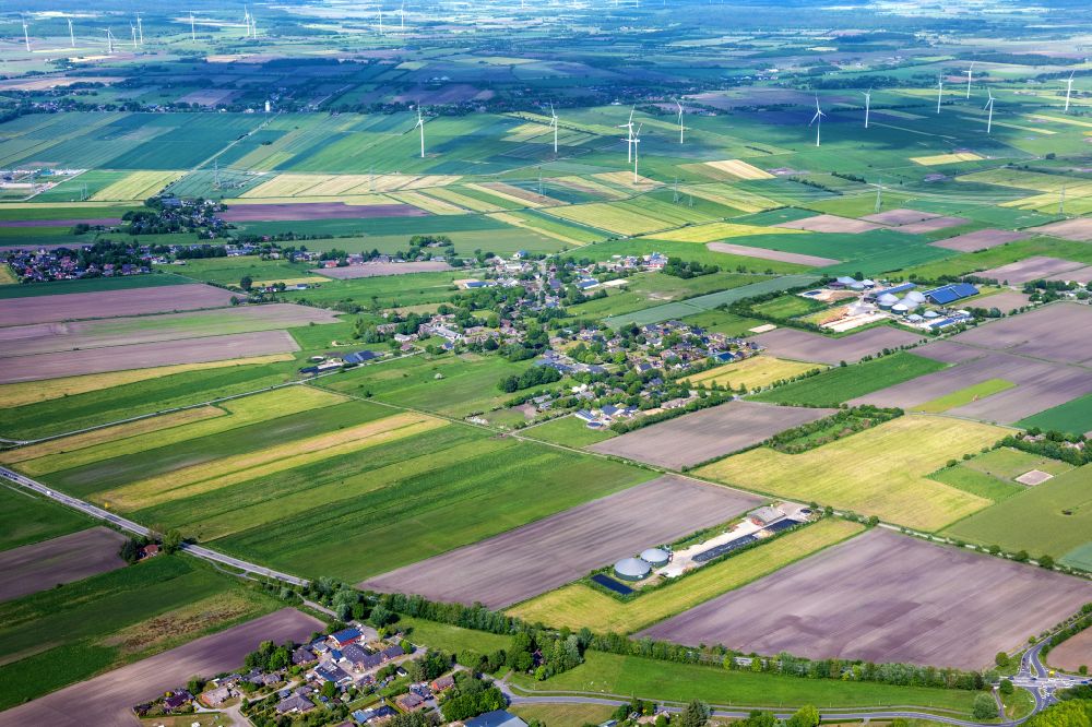 Risum-Lindholm from above - Agricultural land and field boundaries surround the settlement area of the village in Klockries North Friesland in the state Schleswig-Holstein, Germany