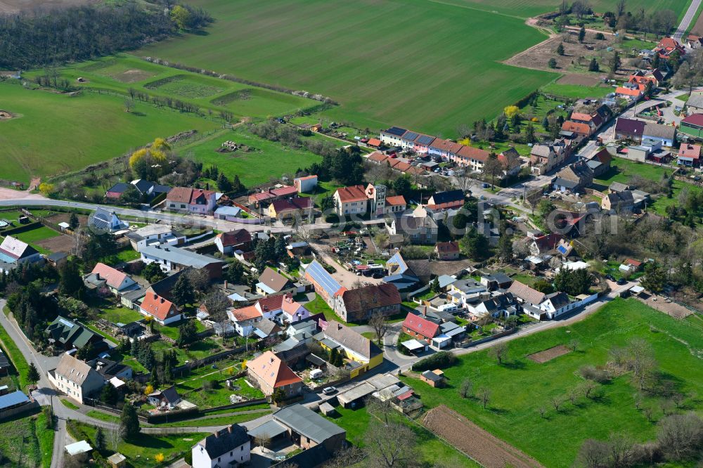 Könnern from the bird's eye view: Agricultural land and field boundaries surround the settlement area of the village in Könnern in the state Saxony-Anhalt, Germany