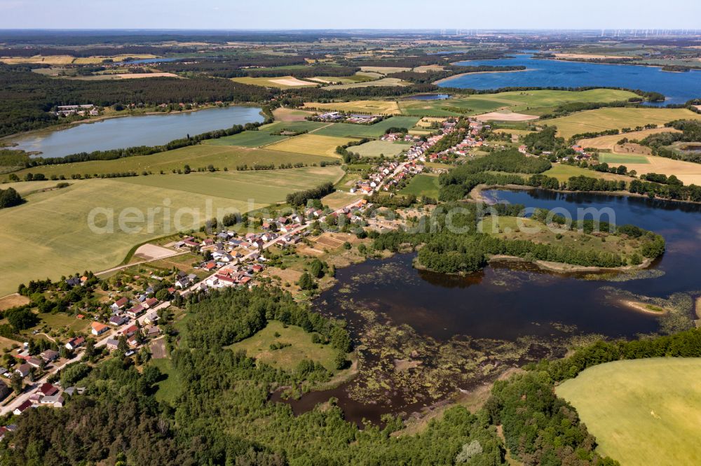 Brodowin from above - Agricultural land and field boundaries surround the settlement area of the village vom Oekodorf Brodowin in the state Brandenburg, Germany