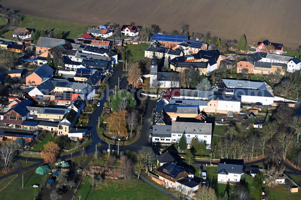 Kolba from the bird's eye view: Agricultural land and field boundaries surround the settlement area of the village in Kolba in the state Thuringia, Germany