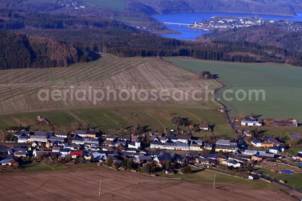 Kolba from the bird's eye view: Agricultural land and field boundaries surround the settlement area of the village in Kolba in the state Thuringia, Germany